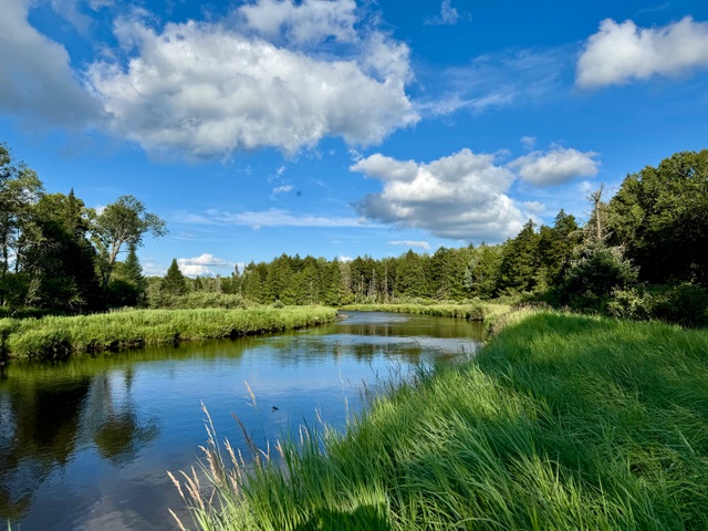 Blue sky and clouds over Cedar River in Hamilton County, NY